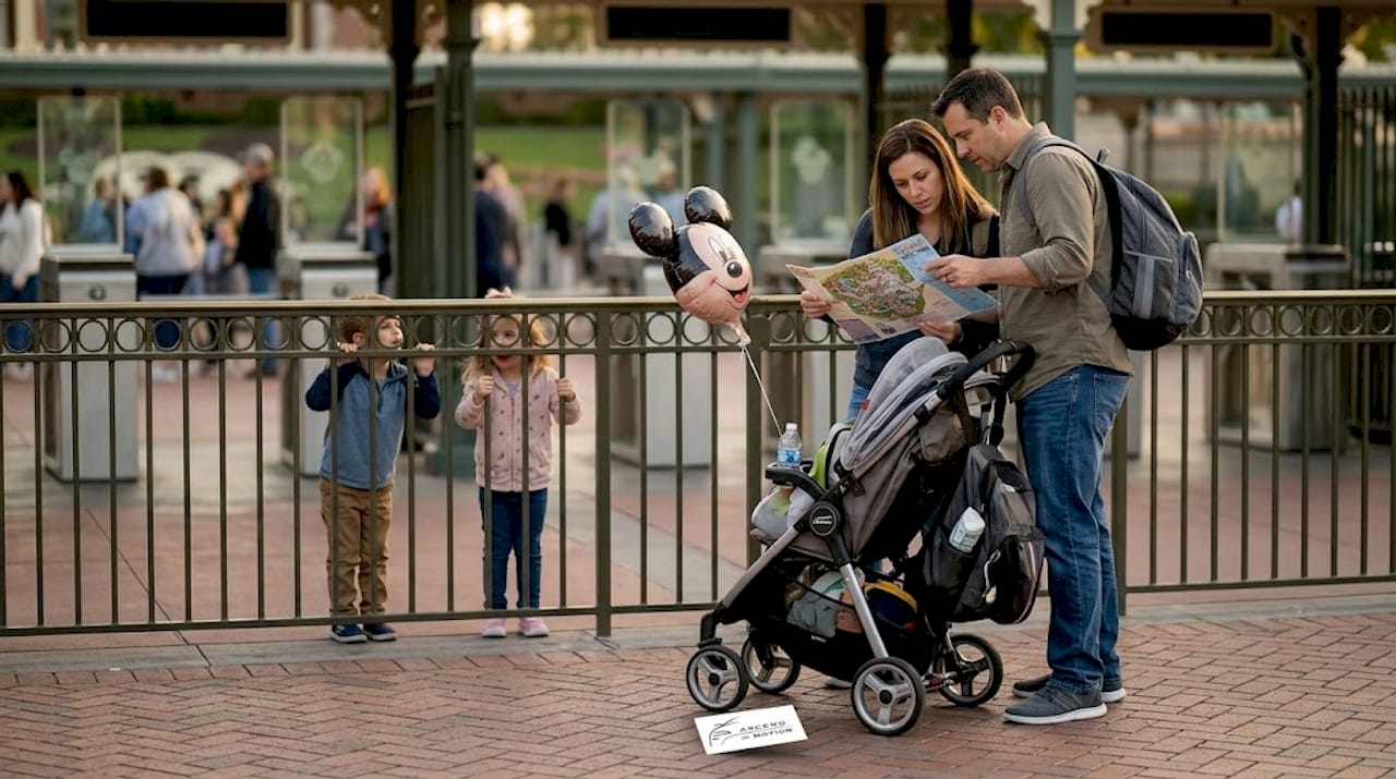 Family with luggage at Disneyland entrance area