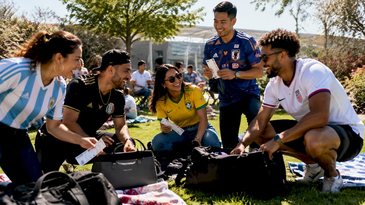 Group boarding black Sprinter van for World Cup