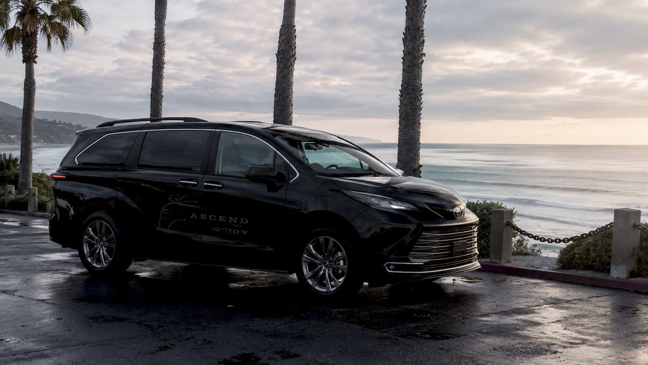 Black Ascend in Motion minivan at LAX curbside