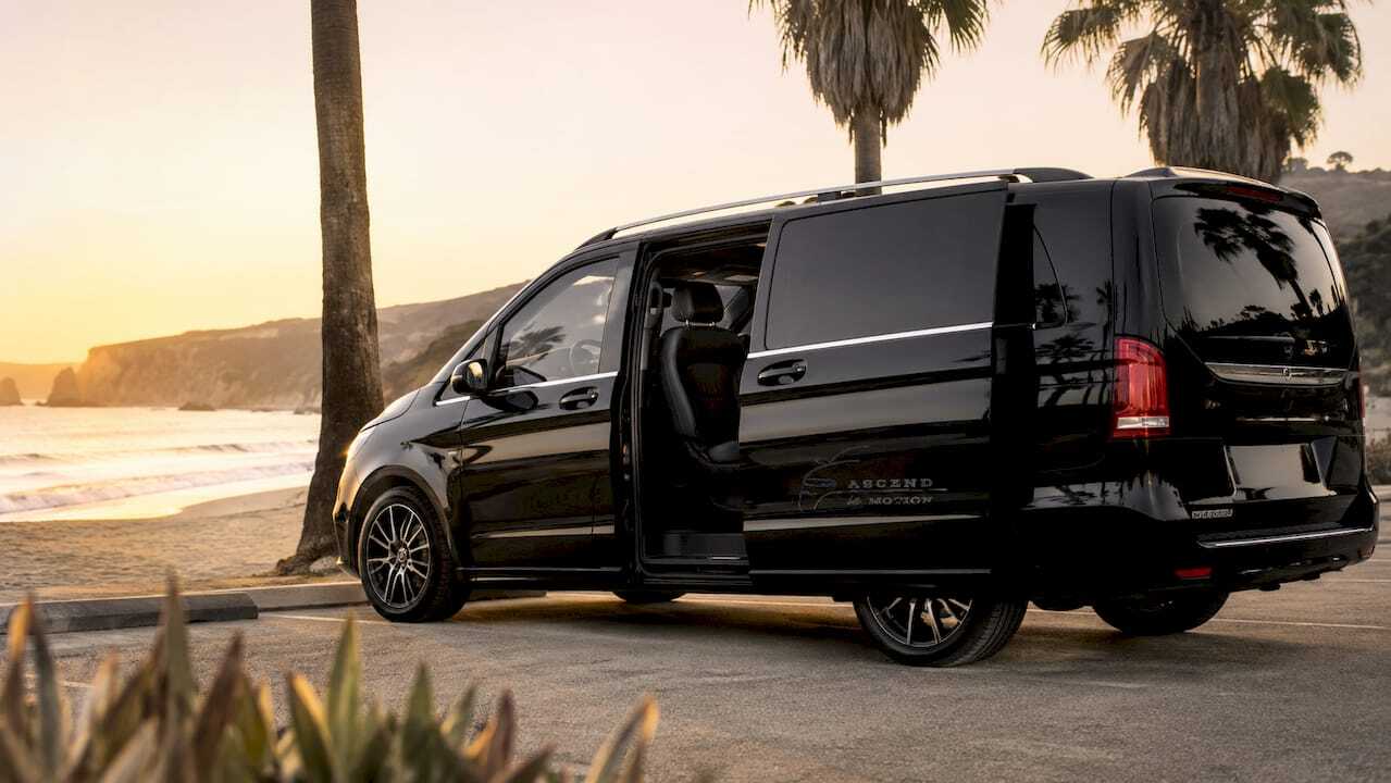 Ascend in Motion black minivan at LAX terminal