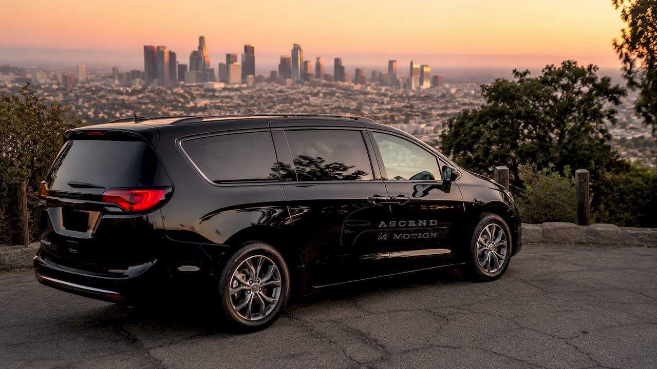 Ascend in Motion black minivan at LAX airport terminal