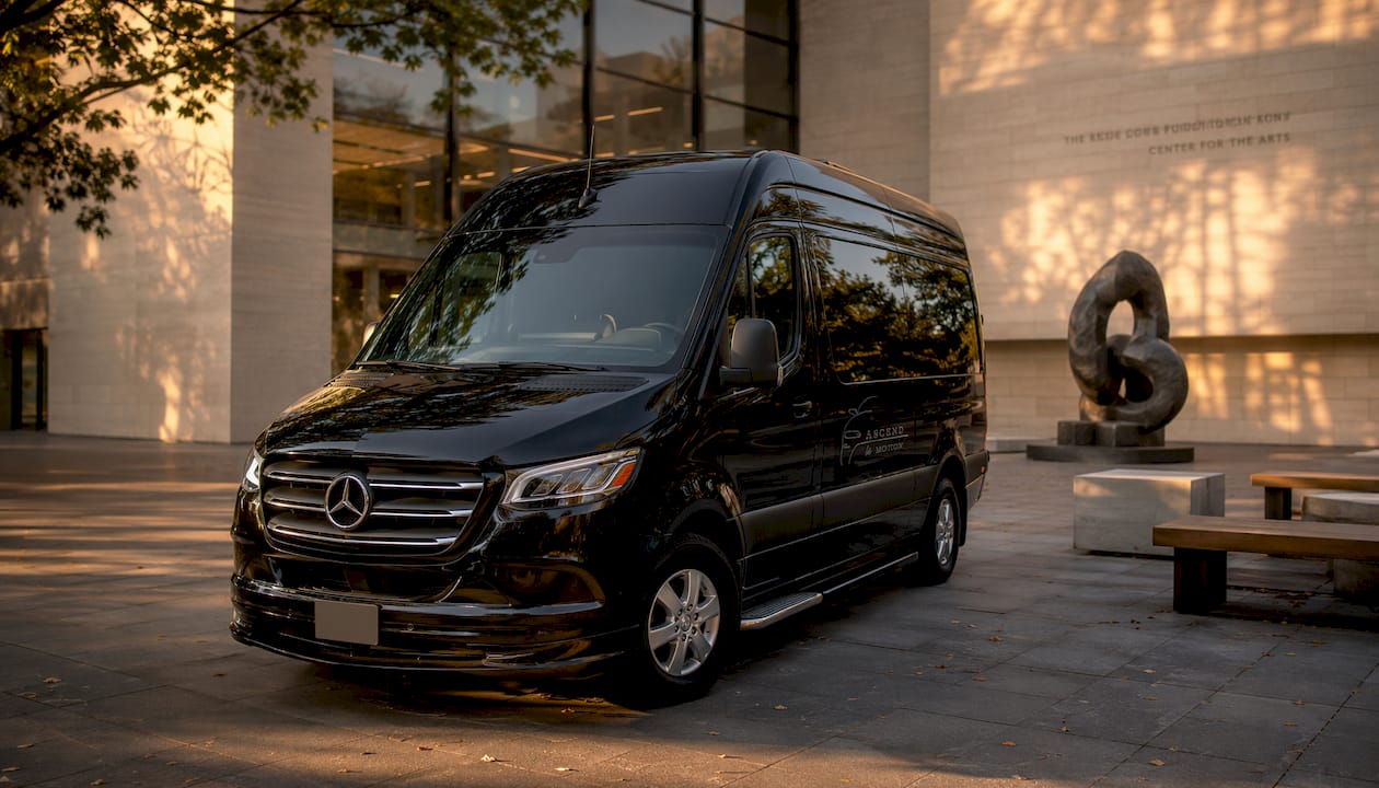 Black Ascend in Motion Sprinter van outside hotel
