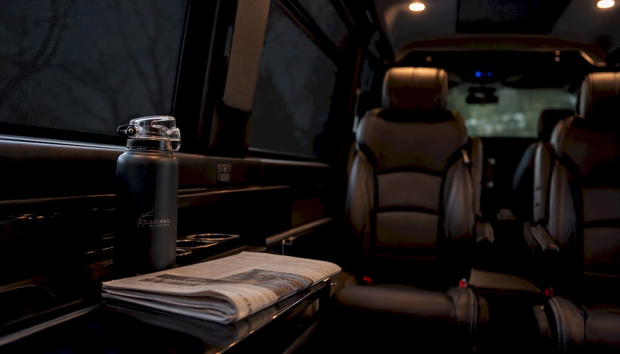 Luxury minivan interior with leather seats and ambient light