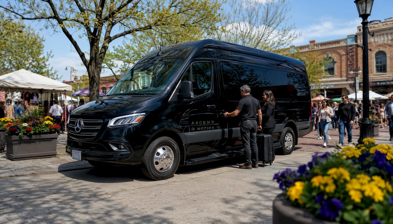 Ascend in Motion branded black Mercedes-Benz Sprinter van