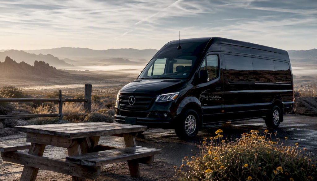 Black Ascend in Motion Mercedes-Benz Sprinter minivan roadside
