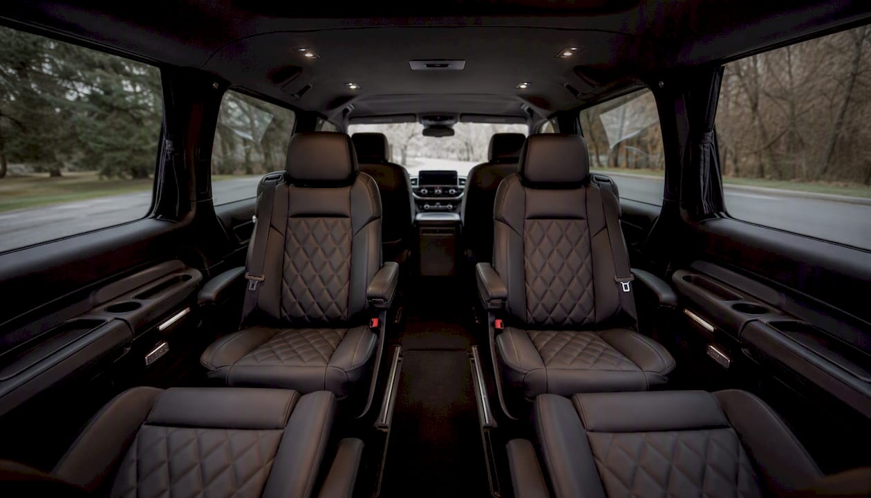 Spacious interior of luxury black minivan seats