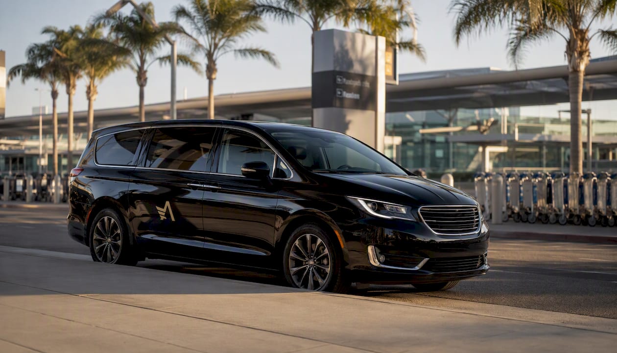 Ascend black minivan parked at LAX curbside