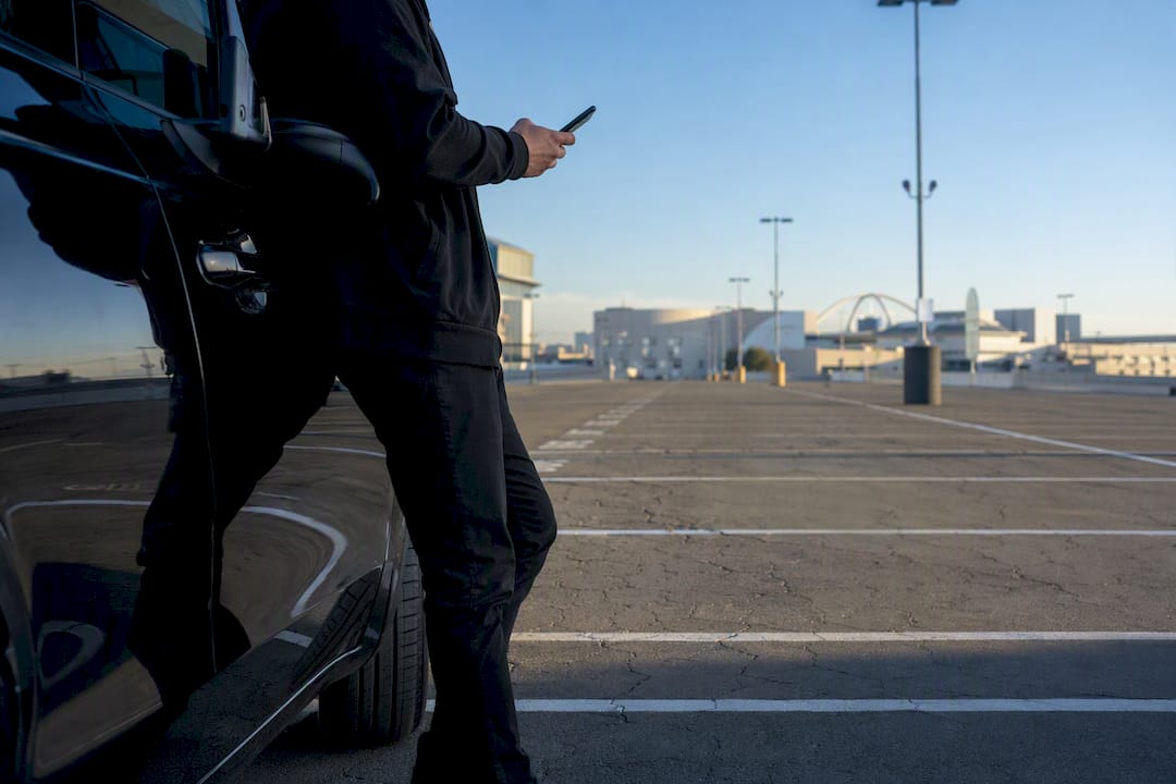 Chauffeur waiting in cell phone lot at LAX