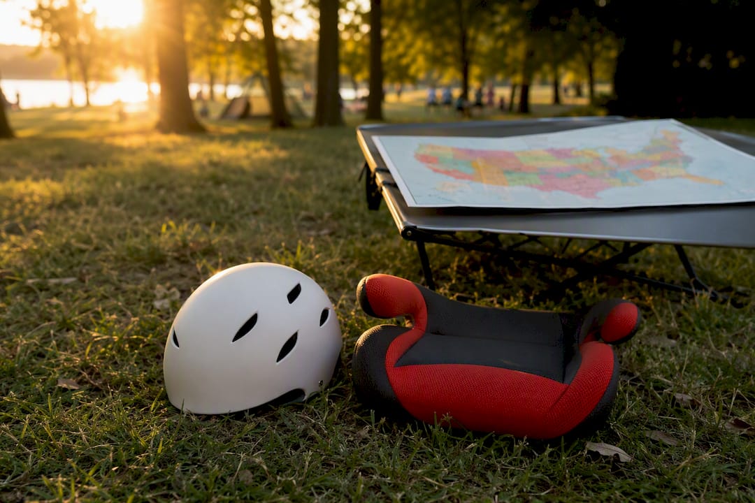 Booster seat manual and safety helmet on desk