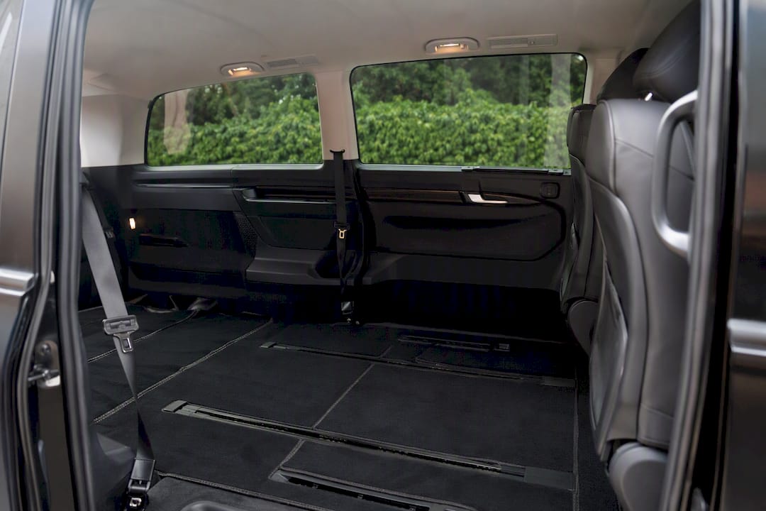 Interior view with folded seats in black minivan