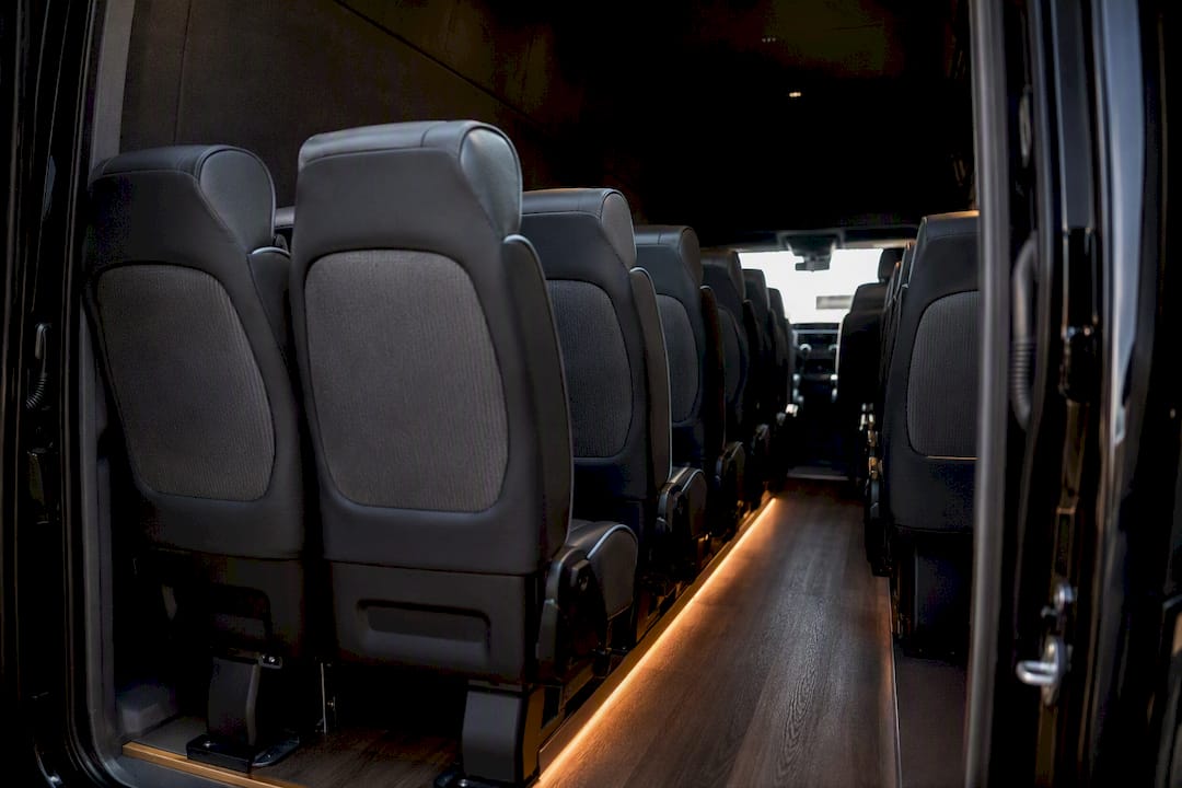 Rows of Sprinter passenger seats viewed from rear