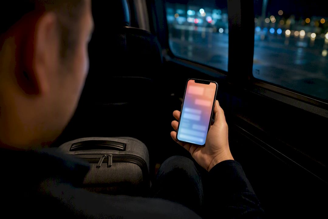 Traveler checking pickup details on phone