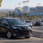 Black chauffeur minivan approaching Dodger Stadium