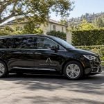 Branded minivan driving through Brentwood